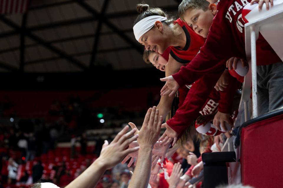 Fans high five Utah Utes players after the game against the Oregon Ducks at the Huntsman Center in Salt Lake City on Jan. 21, 2024. The Utes won 80-77. | Marielle Scott, Deseret News