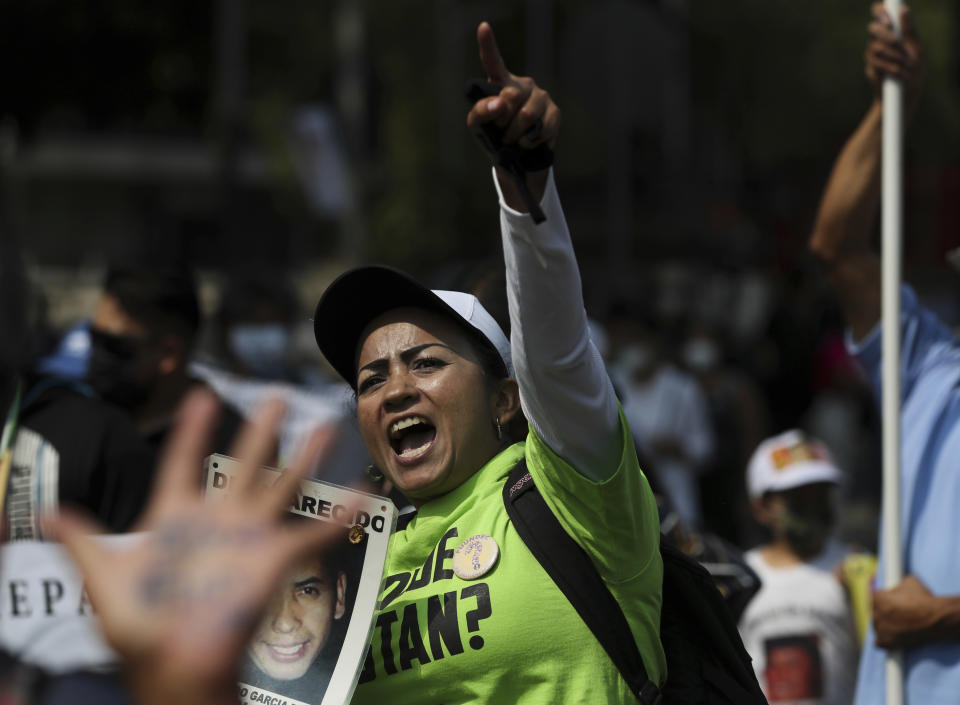 A person shouts "Where are our children?" during a march in remembrance of those who have disappeared, on Mother's Day in Mexico City, Monday, May 10, 2021. (AP Photo/Fernando Llano)