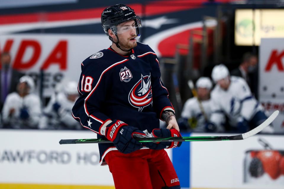 Blue Jackets center Pierre-Luc Dubois skates on the ice during a stop in play.