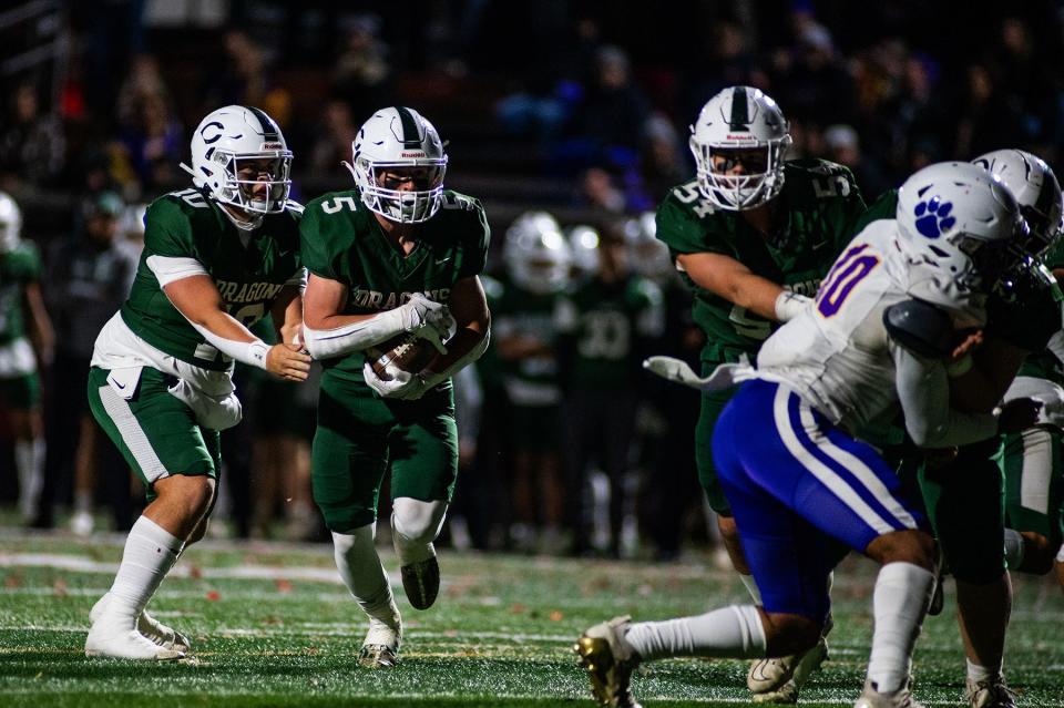 Cornwall's Tyler Vanderpool takes a handoff from Jaiden Laureano during the Section 9 Class A semifinal football game in Beacon, NY on Friday, November 3, 2023. Cornwall defeated Warwick 46-6. KELLY MARSH/FOR THE TIMES HERALD-RECORD