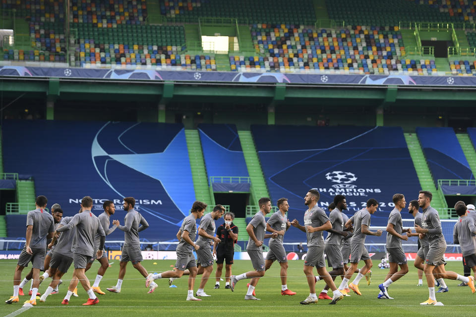 Atletico Madrid players exercise during a training session at the Jose Alvalade stadium in Lisbon, Wednesday Aug. 12, 2020. Atletico Madrid will play Leipzig in a Champions League quarterfinals soccer match on Thursday. (Lluis Gene/Pool via AP)