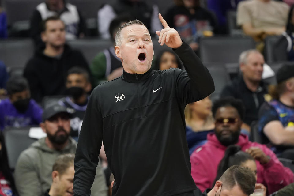 Denver Nuggets coach Michael Malone gestures to players during the first half of the team's NBA basketball game against the Sacramento Kings in Sacramento, Calif., Wednesday, March 9, 2022. (AP Photo/Jeff Chiu)