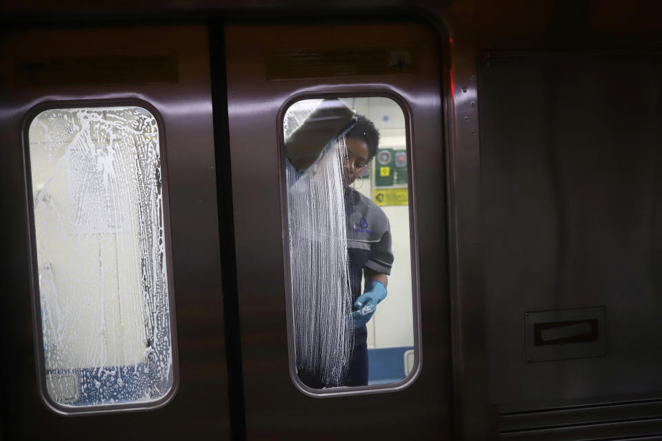 A cleaner works on the disinfection of a subway train as a measure against the coronavirus disease (COVID-19) in Sao Paulo