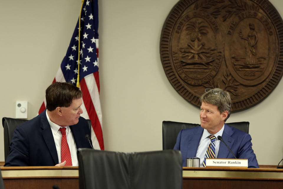 House Speaker Jay Lucas, R-Hartsville, left, talks to Senate Judiciary Chairman Luke Rankin, R-Myrtle Beach, right, during a meeting over a Santee Cooper overhaul bill on Tuesday, June, 1, 2021, in Columbia, S.C. Powerful legislative leaders reached a compromise on the bill that will be considered at a special session. (AP Photo/Jeffrey Collins)