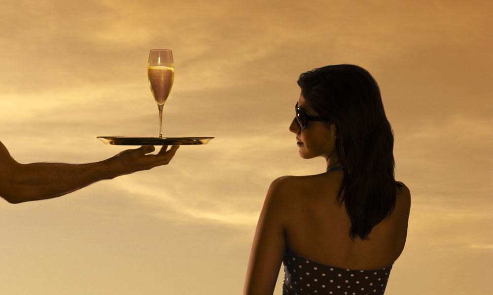 A woman being served champagne