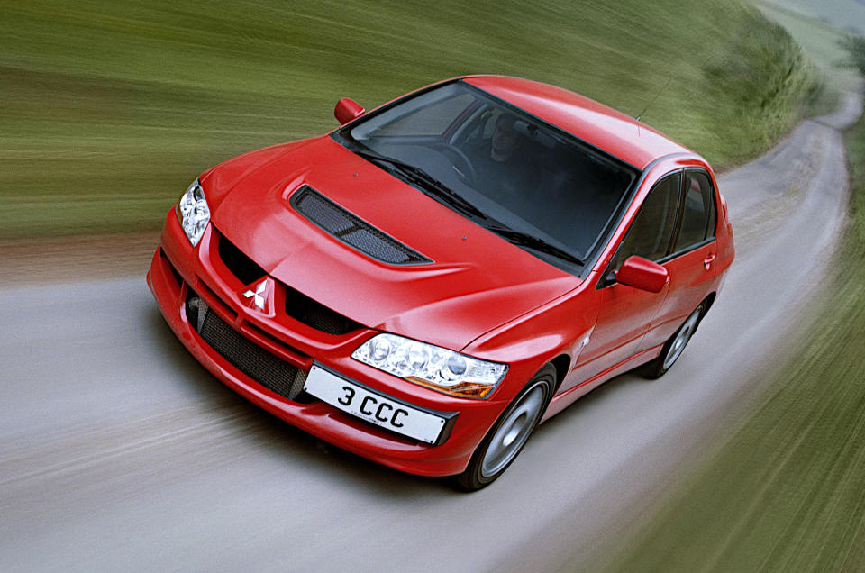 <p>In each of its ten generations, the Evolution derivative of the <strong>Mitsubishi Lancer</strong> was a four-door saloon with <strong>four-wheel drive</strong> and a <strong>turbocharged 2.0-litre</strong> petrol engine. In 2014, Mitsubishi UK, celebrating its 40th anniversary, built 40 examples of the <strong>Evo X FQ-440 MR</strong>, which produced, as its name suggested, <strong>440bhp</strong>. At <strong>220.2bhp</strong> per litre, this is the highest specific output of any four-cylinder road car, and second overall only to the <strong>Koenigsegg Jesko</strong>.</p><p>Evos were fabulous high-performance road cars, but their greatest value was the publicity they gained for Mitsubishi due to their success in international rallying. <strong>Tommi Mäkinen</strong> (born 1964) won the World Rally Championship for Drivers every year from 1996 to 1999 in these cars, and Mitsubishi won the Manufacturers’ title in 1997.</p>