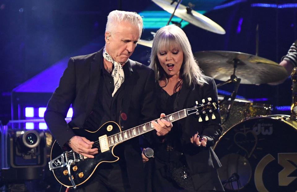 Singer-songwriter Pat Benatar and Neil Giraldo perform on stage during the 37th Annual Rock and Roll Hall of Fame Induction Ceremony at the Microsoft Theatre on Nov. 5, 2022, in Los Angeles.
