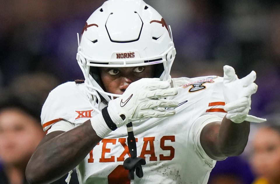 Texas Longhorns wide receiver Xavier Worthy (1) celebrates a play in the fourth quarter of the Sugar Bowl College Football Playoff semi-finals at the Ceasars Superdome in New Orleans, Louisiana, Jan. 1, 2024. The Huskies won the game 37-31.