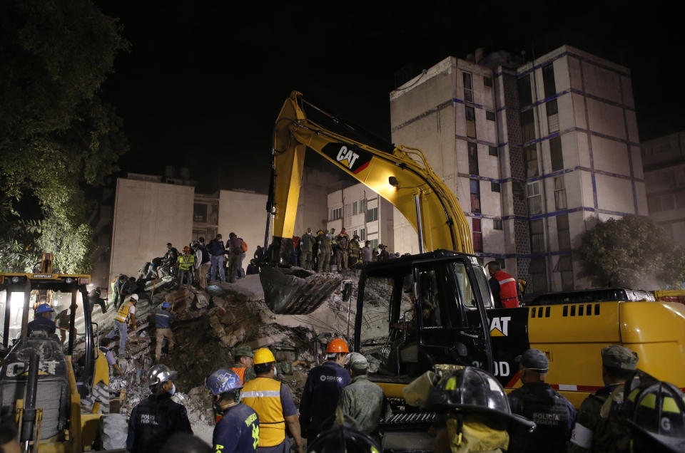 <p>Rescue workers search for people trapped in a collapsed building in the Piedad Narvarte neighborhood of Mexico City, Wednesday, Sept. 20, 2017. A magnitude 7.1 earthquake has stunned central Mexico, killing more than 100 people as buildings collapsed in plumes of dust. Thousands fled into the streets in panic, and many stayed to help rescue those trapped. (AP Photo/Rebecca Blackwell) </p>