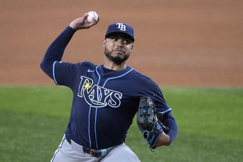 Tampa Bay Rays starting pitcher Taj Bradley throws to the Texas Rangers in the fourth inning of a baseball game in Arlington, Texas, Saturday, July 6, 2024. (AP Photo/Tony Gutierrez)