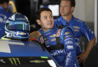 FILE - In this Feb. 15, 2019, file photo, Kyle Larson gets into his car during Daytona 500 auto race practice at Daytona International Speedway in Daytona Beach, Fla. Reinstated last week by NASCAR, Larson on Wednesday, Oct. 28, 2020, signed a multi-year contract with Hendrick Motorsports to drive the No. 5 Chevrolet next season. Hendrick has sold no sponsorship as of yet for Larson and only needed the blessing of Chevrolet, one of the partners that originally dropped Larson for using the n-word, to finalize the deal. (AP Photo/Chris O'Meara, File)