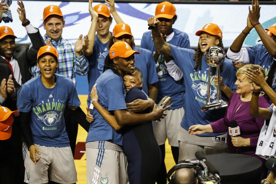 FILE - Minnesota Lynx center Sylvia Fowles hugs WNBA president Lisa Borders after receiving the MVP trophy as the Lynx celebrate their WNBA championship, Wednesday, Oct. 4, 2017 in Minneapolis. Fowles, one of the league's greatest centers, is ready to move on to another career in mortuary science, no longer possessing the energy to stay in basketball shape. (Renee Jones Schneider/Star Tribune via AP, File)