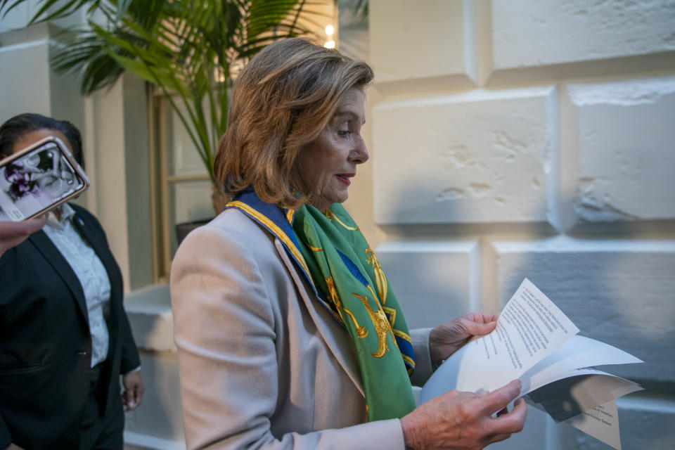 Speaker of the House Nancy Pelosi, D-Calif., arrives to meet with the Democratic Caucus at the Capitol in Washington, Tuesday, Jan. 14, 2020. Pelosi, who has not yet relayed the articles of impeachment to the Senate for the trial of President Donald Trump, has said she will discuss her next steps in that delayed process during her meeting today with fellow Democrats. Trump was impeached by the Democratic-led House last month on charges of abuse of power over pushing Ukraine to investigate Democratic rival Joe Biden and obstruction of Congress in the probe. (AP Photo/J. Scott Applewhite)