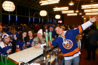 <p>Tyler Cameron serves up Heineken to New York Islanders fans at the Heineken Terrace Bar inside the new UBS Arena in Elmont, New York, on Nov. 20.</p>