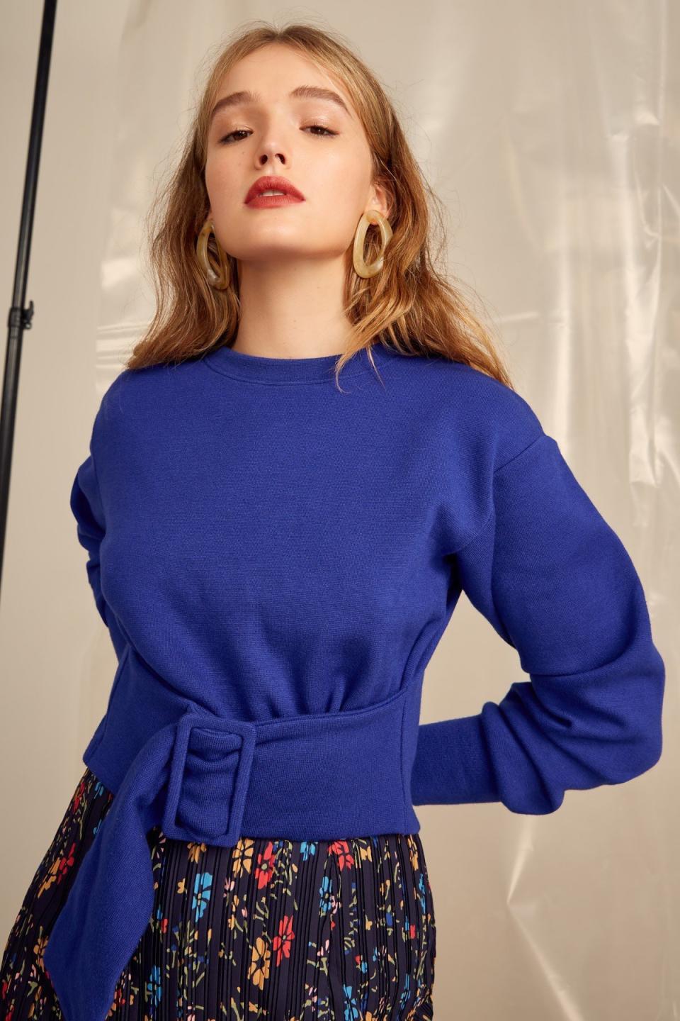 <strong><a href="https://us.fashionbunker.com/the-moments-sweater-cobalt" target="_blank" rel="noopener noreferrer">C/Meo Collective cropped belted sweater</a>, $160</strong>