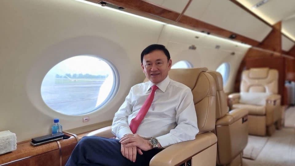 Former Thai Prime Minister Thaksin Shinawatra as he ends almost two decades of self-imposed exile, pictured inside a plane at an unknown location in this image released on August 22. - Yingluck Shinawatra/Facebook/Reuters