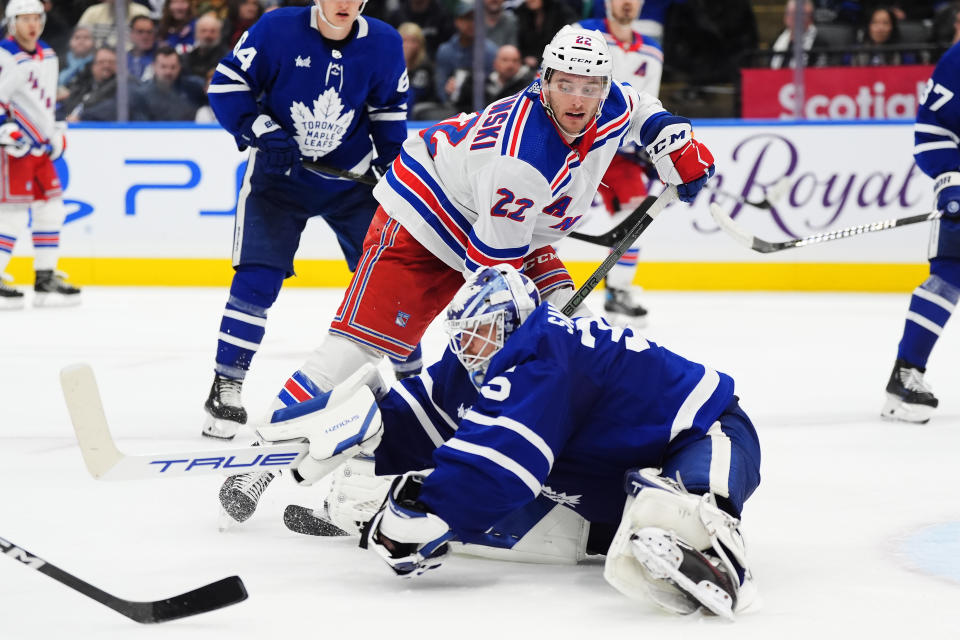 Toronto Maple Leafs goaltender Ilya Samsonov (35) makes a save as New York Rangers' Jonny Brodzinski (22) looks on during the third period of an NHL hockey game in Toronto on Saturday, March 2, 2024. (Frank Gunn/The Canadian Press via AP)