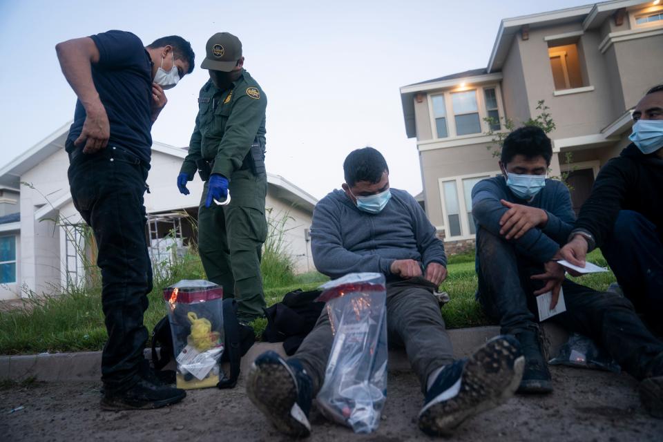 Border Patrol agents detain more than a dozen people found hiding in a “stash house,” a vacant, under-construction home in the town of Mission, Texas, near the U.S.-Mexican border July 13.
