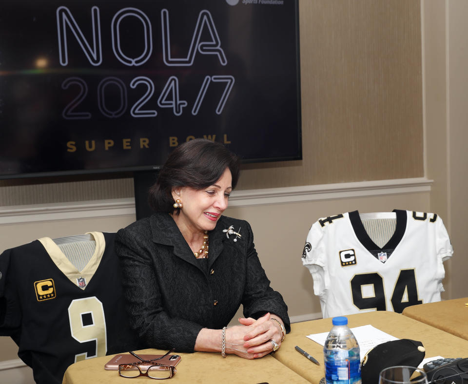 New Orleans Saints owner Gayle Benson uses a speaker phone to inform Governor of Louisiana John Bel Edwards other elected officials that New Orleans has been awarded the 2024 Super Bowl during the NFL owner's spring meeting Wednesday, May 23, 2018, in Atlanta. (AP Photo/John Bazemore)