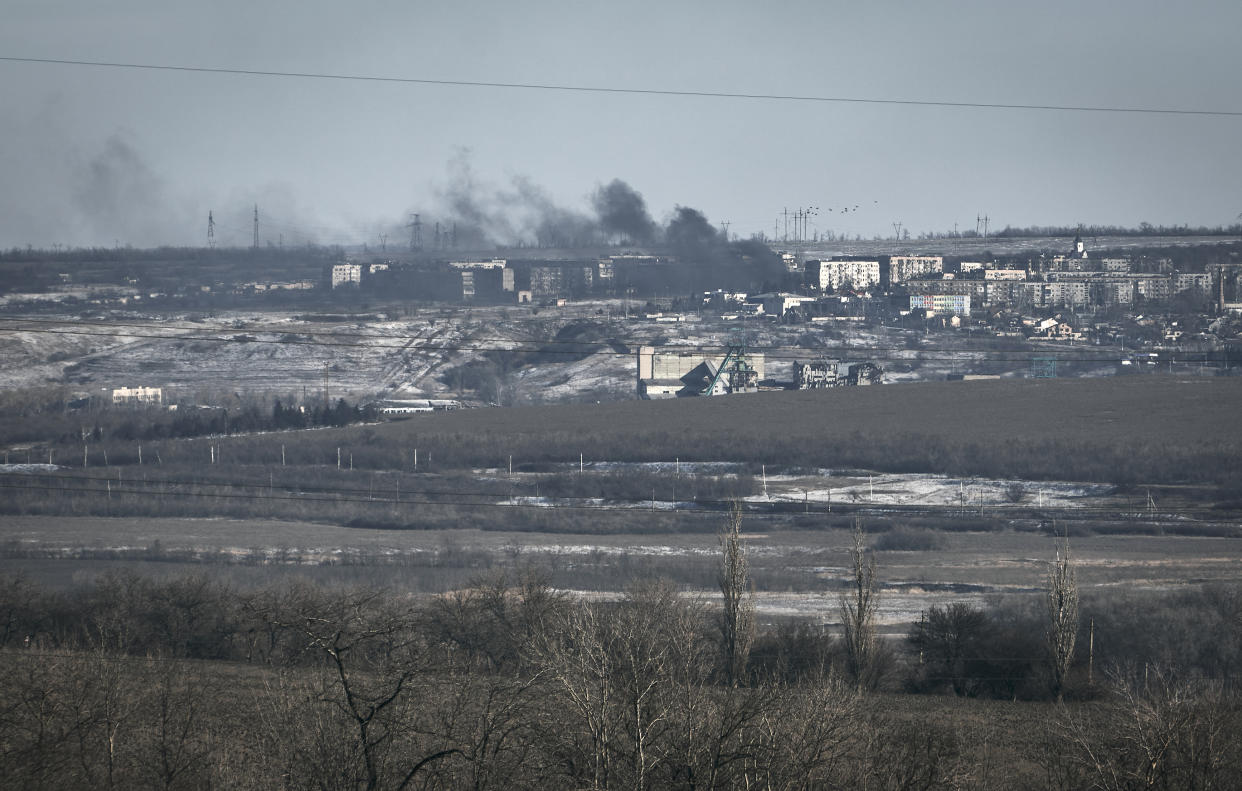 Clouds of black smoke billow from Soledar after shelling.