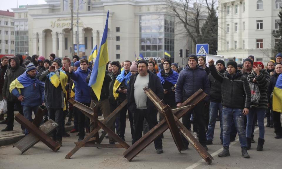 People shout toward Russian army soldiers during a rally against the Russian occupation in Svobody (Freedom) Square in Kherson on 7 March.