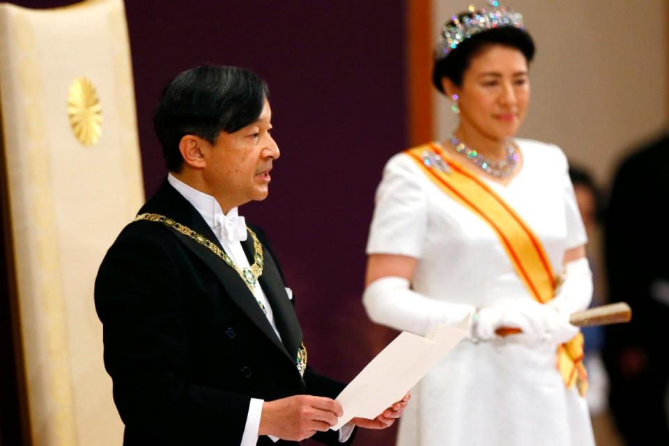 Naruhito, accompanied by empress Masako, makes his first address during a ritual after succeeding his father Akihito at Imperial Palace in Tokyo in May 2019 (AP)