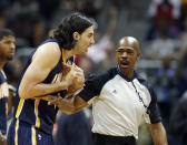 Indiana Pacers forward Luis Scola, left, argues with an official in the first half of Game 3 of an NBA basketball first-round playoff series against the Atlanta Hawks, Thursday, April 24, 2014, in Atlanta. (AP Photo/John Bazemore)