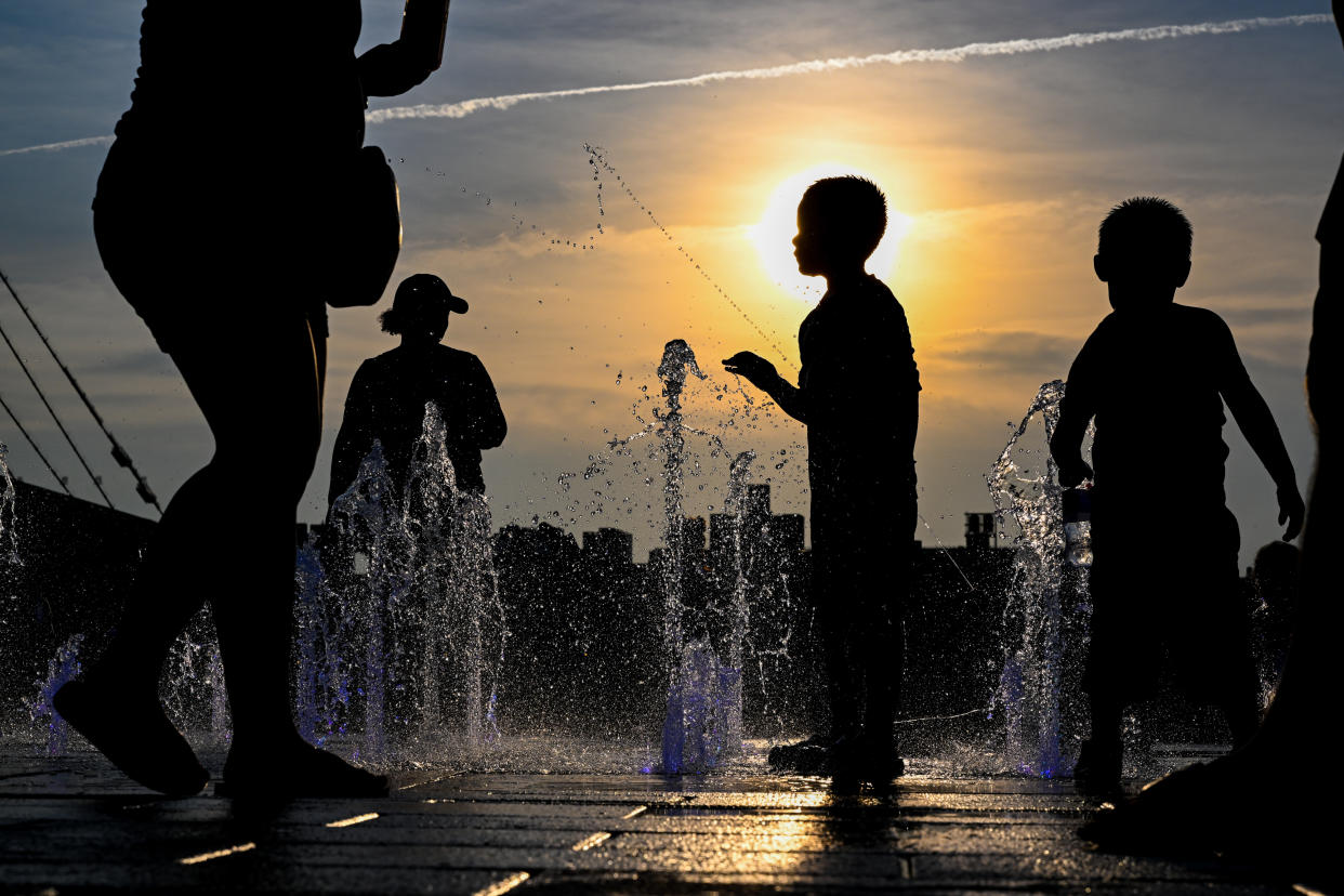 Children cool off in Domino Park, Brooklyn, during a July 2022 heat wave