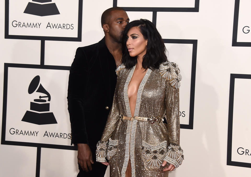 Kim Kardashian, left and Kanye West arrive at the 57th annual Grammy Awards at the Staples Center on Sunday, Feb. 8, 2015, in Los Angeles. (Photo by Jordan Strauss/Invision/AP)