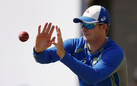 Cricket - India v Australia - Australia team practice session - Jharkhand State Cricket Association Stadium, Ranchi, India - 15/03/17 - Australia's captain Steve Smith catches the ball. REUTERS/Adnan Abidi