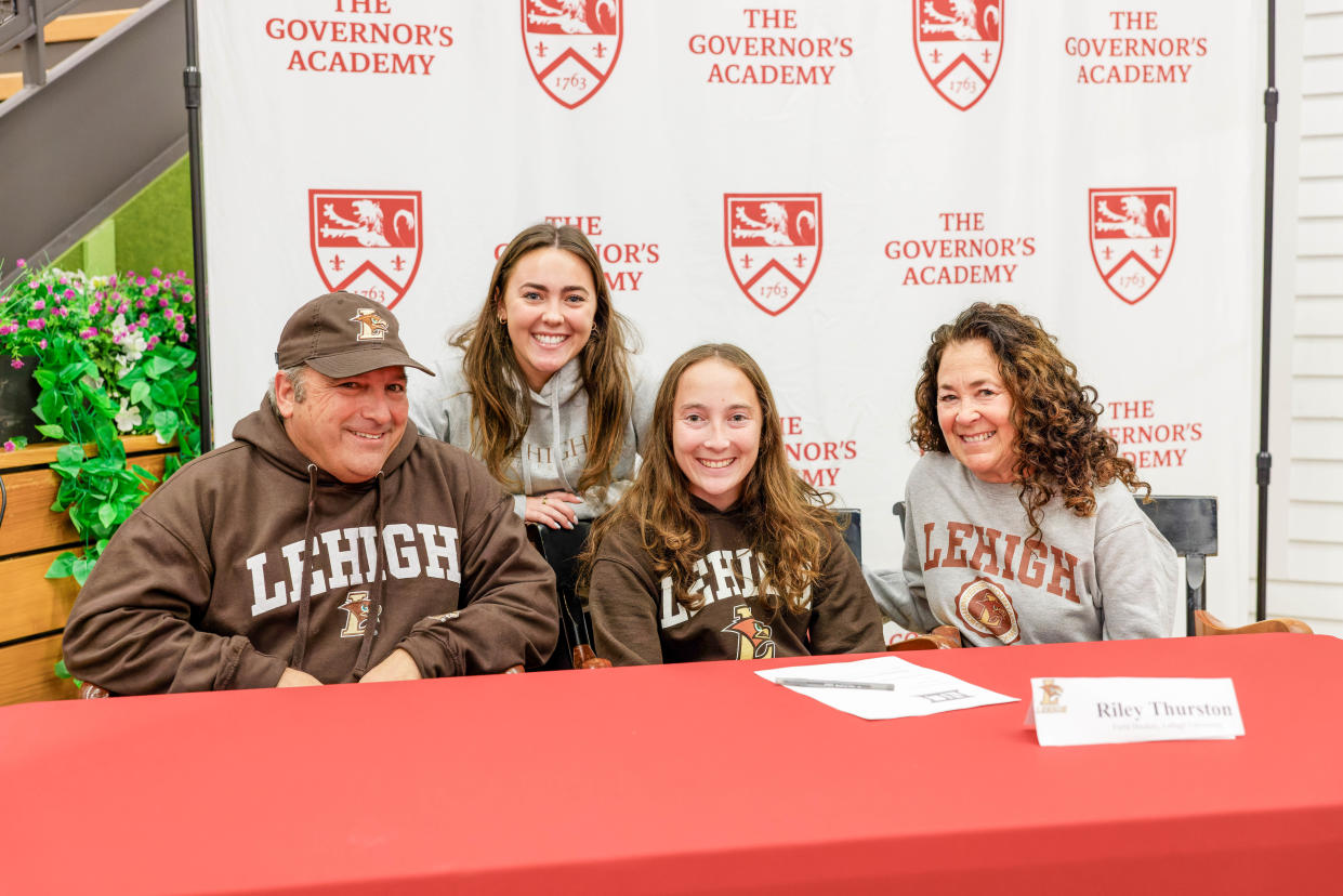 Governor's Academy senior Riley Thurston, third from left, recently signed her letter of commitment to play field hockey at Lafayette University. She is pictured with, from left, her father, Mark; her sister, Brooke; and her mother, Virginia.