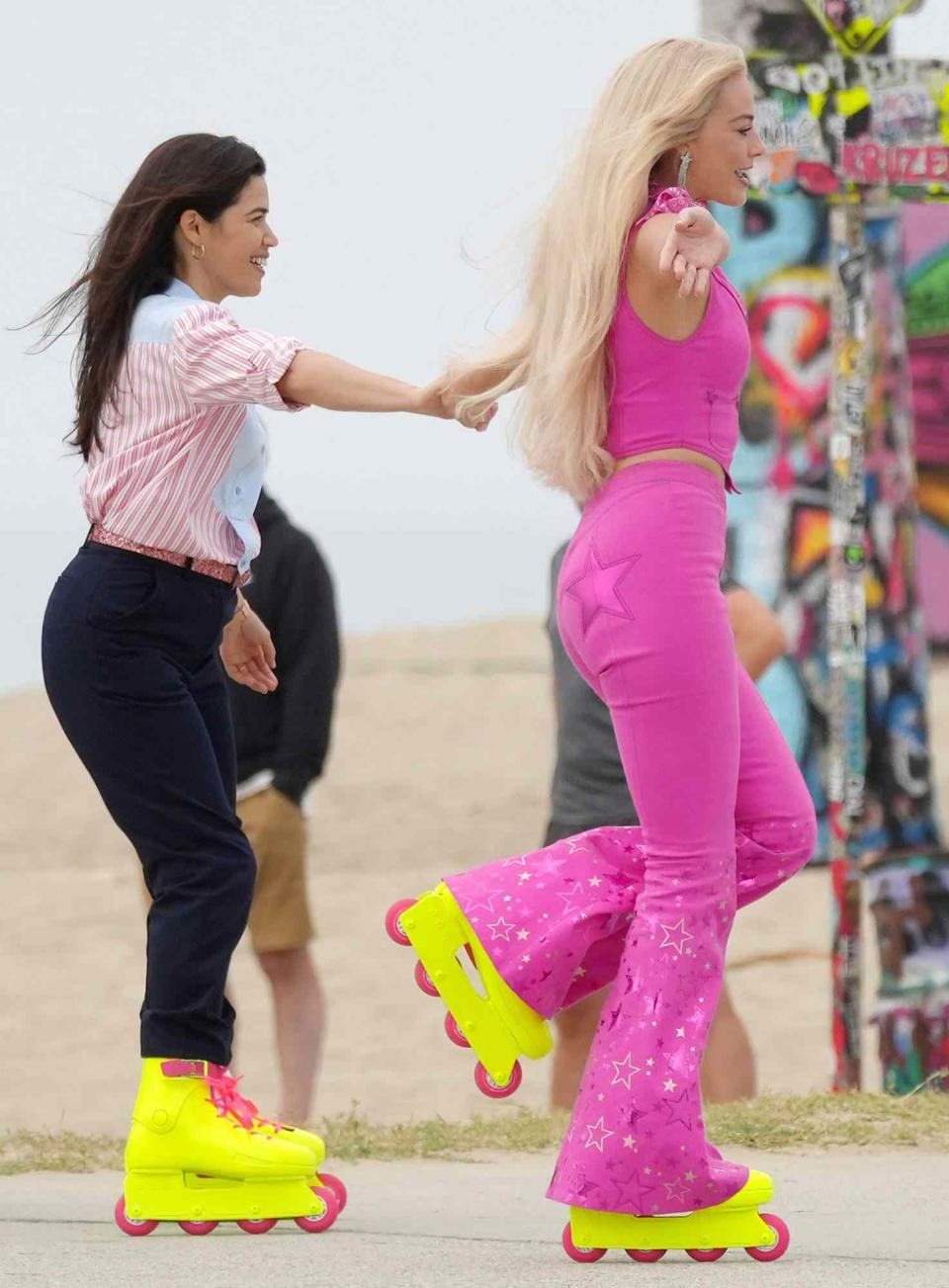 <p>Robbie looked happy and carefree as she filmed alongside Ferrera in rollerblades. </p>