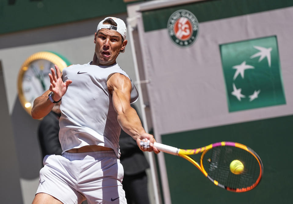 Spain's Rafael Nadal returns the ball during a training session at Roland Garros stadium ahead of the French Open tennis tournament in Paris, Thursday, May 27, 2021. (AP Photo/Michel Euler)