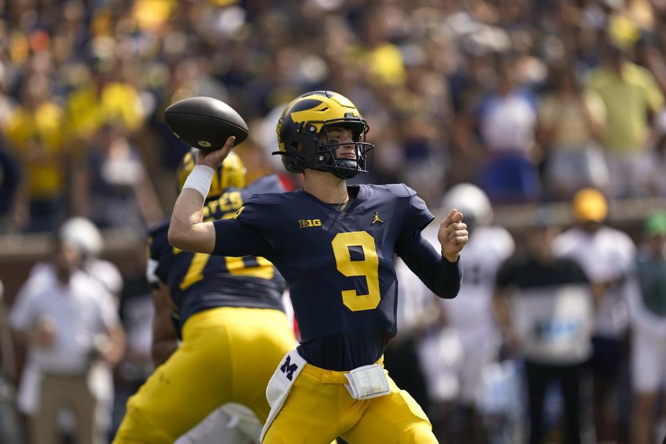 Michigan quarterback J.J. McCarthy throws against Connecticut in the first half of an NCAA college football game in Ann Arbor, Mich., Saturday, Sept. 17, 2022. (AP Photo/Paul Sancya)