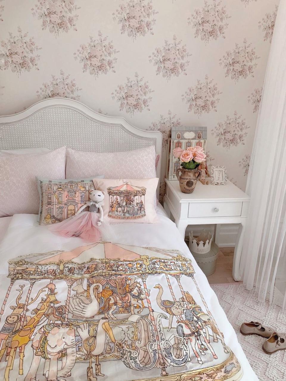 <p>With whimsical illustrations inspired by Paris and a charming pastel pink colour palette, this dreamy girls' bedroom idea is perfect for princesses. Keep the rest of the scheme white so the prints are the focal point, accessorise with pastel coloured rugs, storage and cushions, and choose a wispy ethereal-style curtain to complete the look.</p><p>Pictured: Paris/Carousel reversible quilt and decorative cushions, both <a href="https://atelierchoux.com/en/" rel="nofollow noopener" target="_blank" data-ylk="slk:Atelier Choux;elm:context_link;itc:0;sec:content-canvas" class="link ">Atelier Choux</a></p>