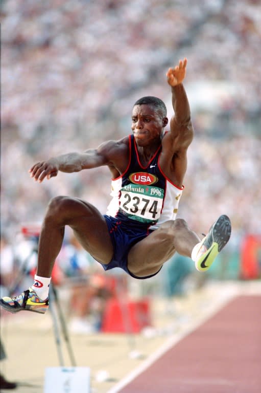 Carl Lewis competes in the men's long jump final at the athletics event of the Atlanta 1996 Olympic Games on July 29, 1996 in Atlanta