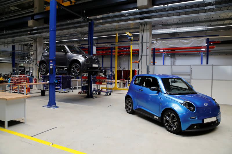 Two e.Go Life city cars of Germany's electric car startup e.GO Mobile AG are seen in the prototype production line in Aachen