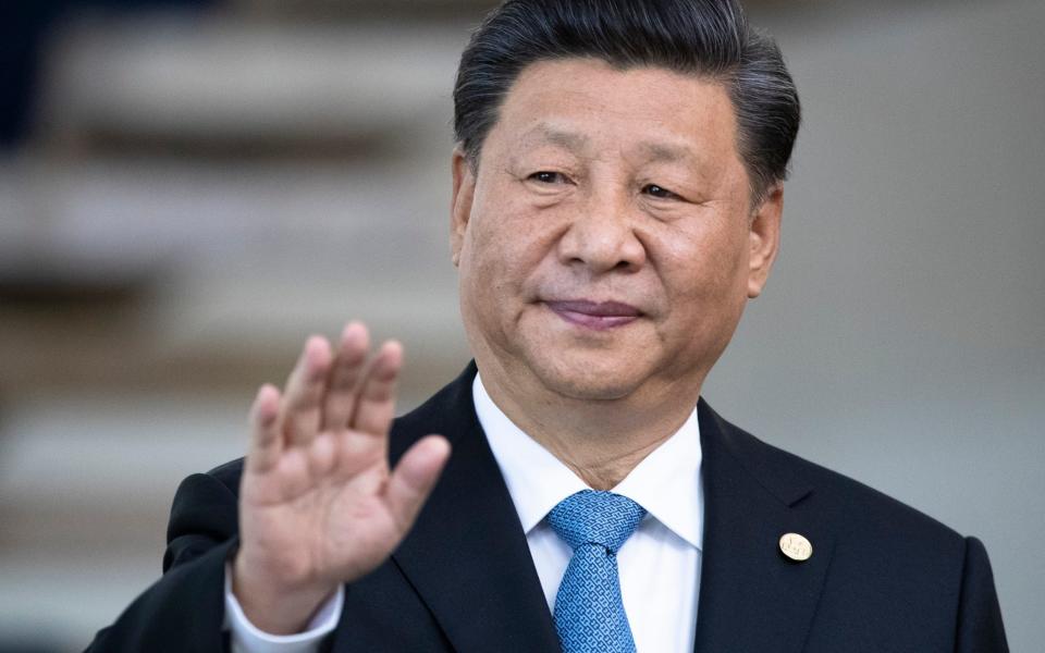 FILE - China's President Xi Jinping greets the media prior to a meeting of leaders of the BRICS emerging economies at the Itamaraty palace in Brasilia, Brazil, on Nov. 14, 2019. Xi is expected to meet his Russian counterpart Vladimir Putin during a visit to the neighboring Central Asian nations of Uzbekistan and Kazakhstan later in September 2022, in what would be his first overseas visits since the start of the COVID-19 outbreak in late 2019. (AP Photo/Pavel Golovkin, Pool, File) - AP Photo/Pavel Golovkin 