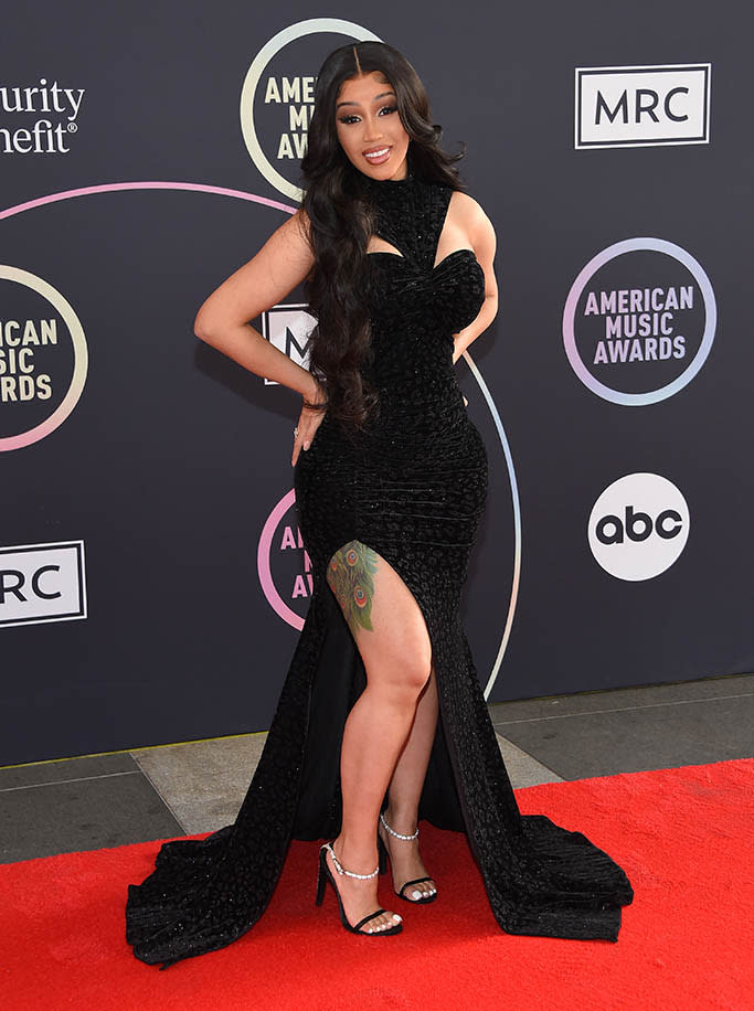 Cardi B at the 2021 American Music Awards red carpet wearing a black velevt Christian Siriano gown. - Credit: OConnor/AFF-USA.com / MEGA