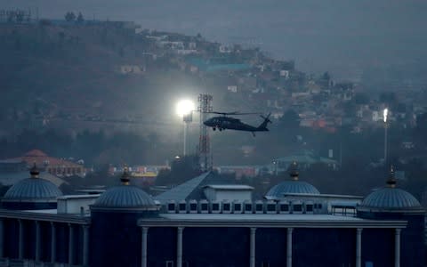 A NATO helicopter lands at the Resolute Support headquarters in Kabul, Afghanistan - Credit: MOHAMMAD ISMAIL/REUTERS