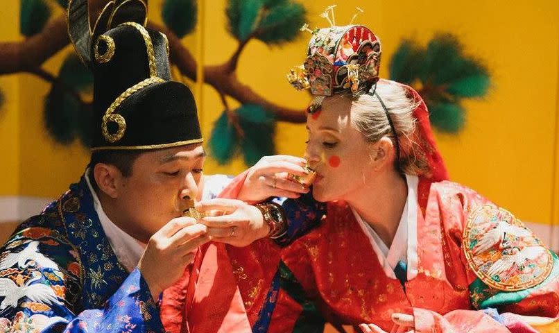 Tony Yoo with his wife in traditional Korean dress on their wedding day. (Image: Tony Yoo)