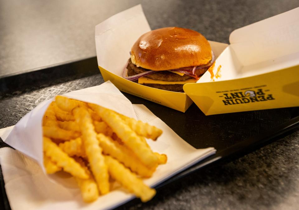 A Mega Double Cheeseburger and fries are shown at Penguin Point’s new South Bend location on Monday, Jan. 17, 2022.