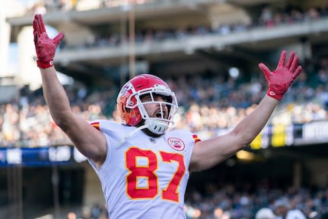 Kansas City Chiefs tight end Travis Kelce (87) celebrates after scoring a touchdown against the Oakland Raiders during the first quarter at Oakland Coliseum - Credit: Kyle Terada/USA TODAY
