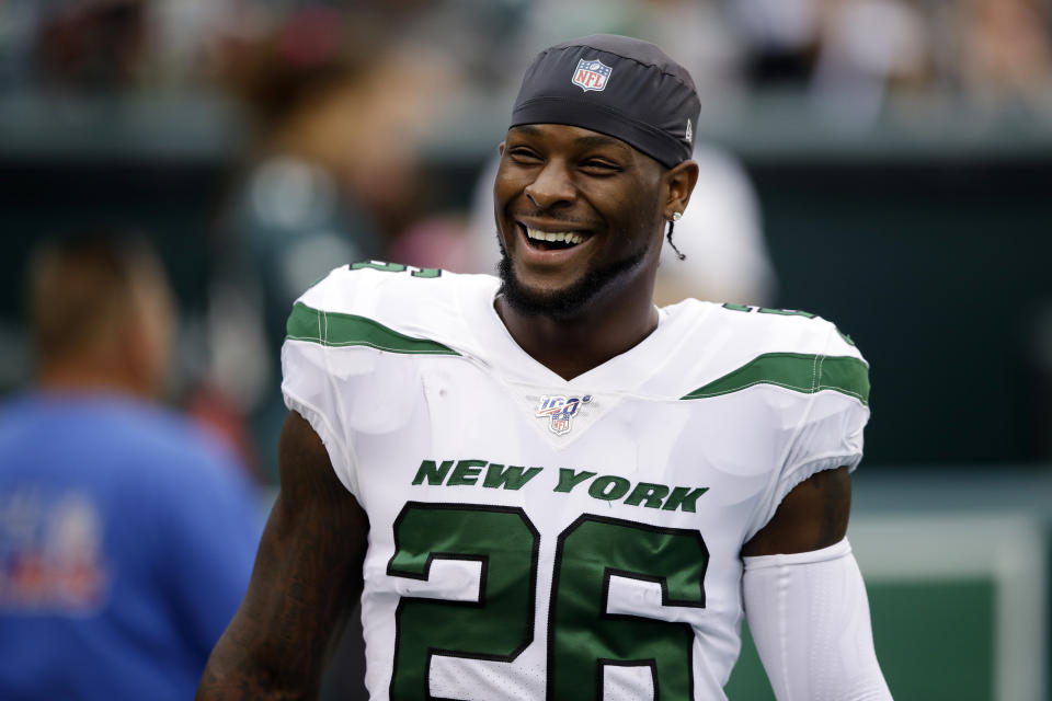 FILE - In this Oct. 6, 2019, file photo, New York Jets running back Le'Veon Bell watches before an NFL football game against the Philadelphia Eagles in Philadelphia. Bell will see lots of familiar faces when he faces his old team on Sunday. The Jets running back spent his first six seasons with the Pittsburgh Steelers, including last year when he sat out all of it in a contract dispute. (AP Photo/Matt Rourke, File)