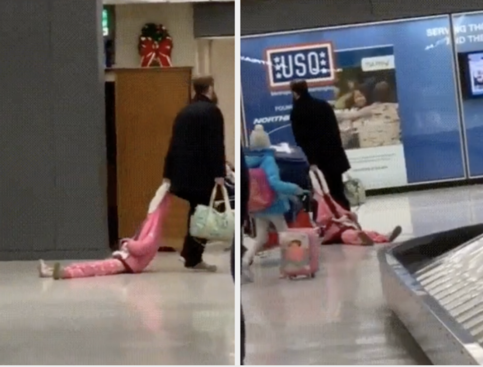 Dad dragging his child along the floor by the top of their jacket hood