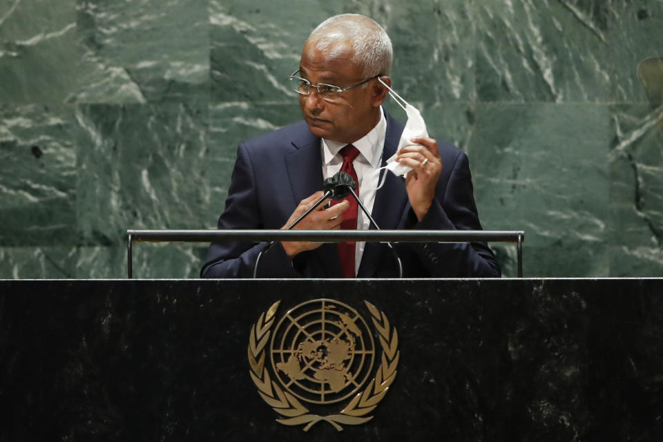 Maldives President Ibrahim Mohamed Solih takes off his mask to address the 76th Session of the United Nations General Assembly at U.N. headquarters in New York on Tuesday, Sept. 21, 2021. (Eduardo Munoz/Pool Photo via AP)