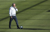 Coach Tite walks the field during a training session of Brazil national soccer team in Porto Alegre, Brazil, Wednesday, June 26, 2019. Brazil will play against Paraguay for a Copa America quarter-final match on June 27.(AP Photo/Natacha Pisarenko)