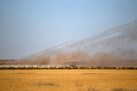 Rockets are launched from Turkey towards Islamic State controlled areas in northern Aleppo countryside, Syria September 30, 2016. REUTERS/Khalil Ashawi