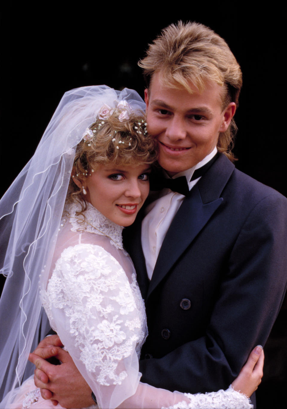 Scott (right), played by Jason Donovan and Charlene, played by Kylie Minogue, tying the knot on Neighbours in the late 1980s. Source: AAP