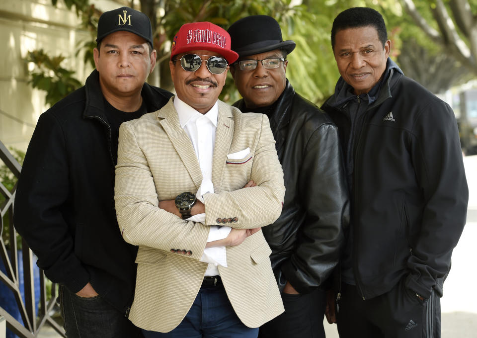 In this Tuesday, Feb. 26, 2019 photo, Marlon Jackson, second from left, Tito Jackson, second from right, and Jackie Jackson, far right, brothers of the late musical artist Michael Jackson, and Tito's son Taj, far left, pose together for a portrait outside the Four Seasons Hotel, in Los Angeles. Michael Jackson’s brothers and nephew say they weren’t surprised by a documentary resurrecting allegations of his sexual abuse of children, and they’re prepared to defend him. (Photo by Chris Pizzello/Invision/AP)